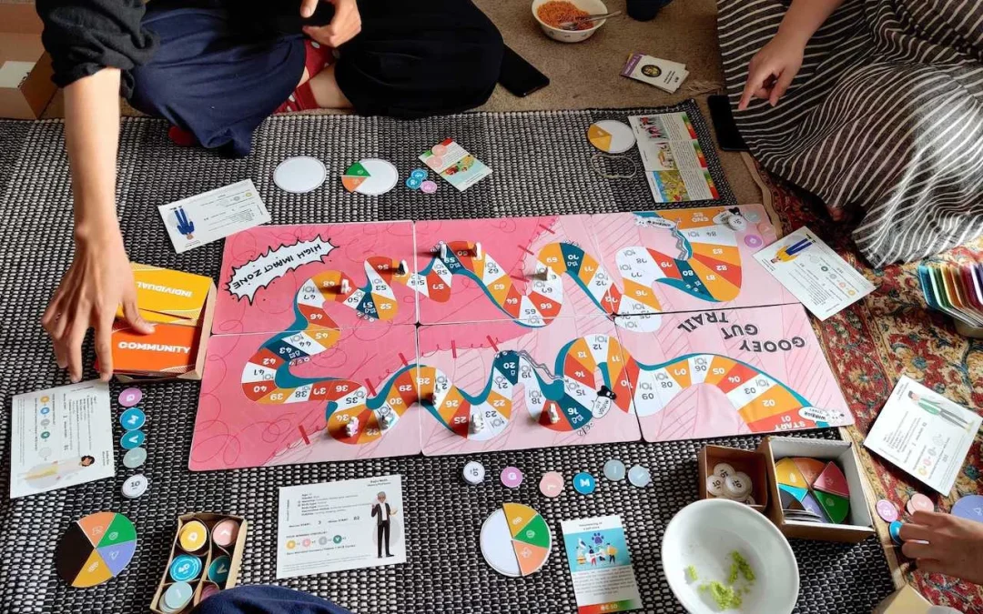 Gooey Gut Trail: Board Game Play to Understand Human-Microbial Interactions