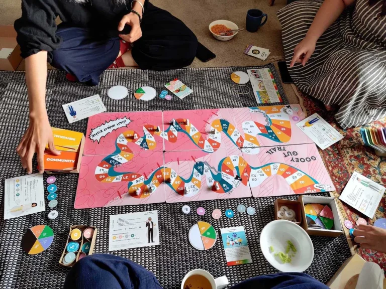 Gooey Gut Trail: Board Game Play to Understand Human-Microbial Interactions